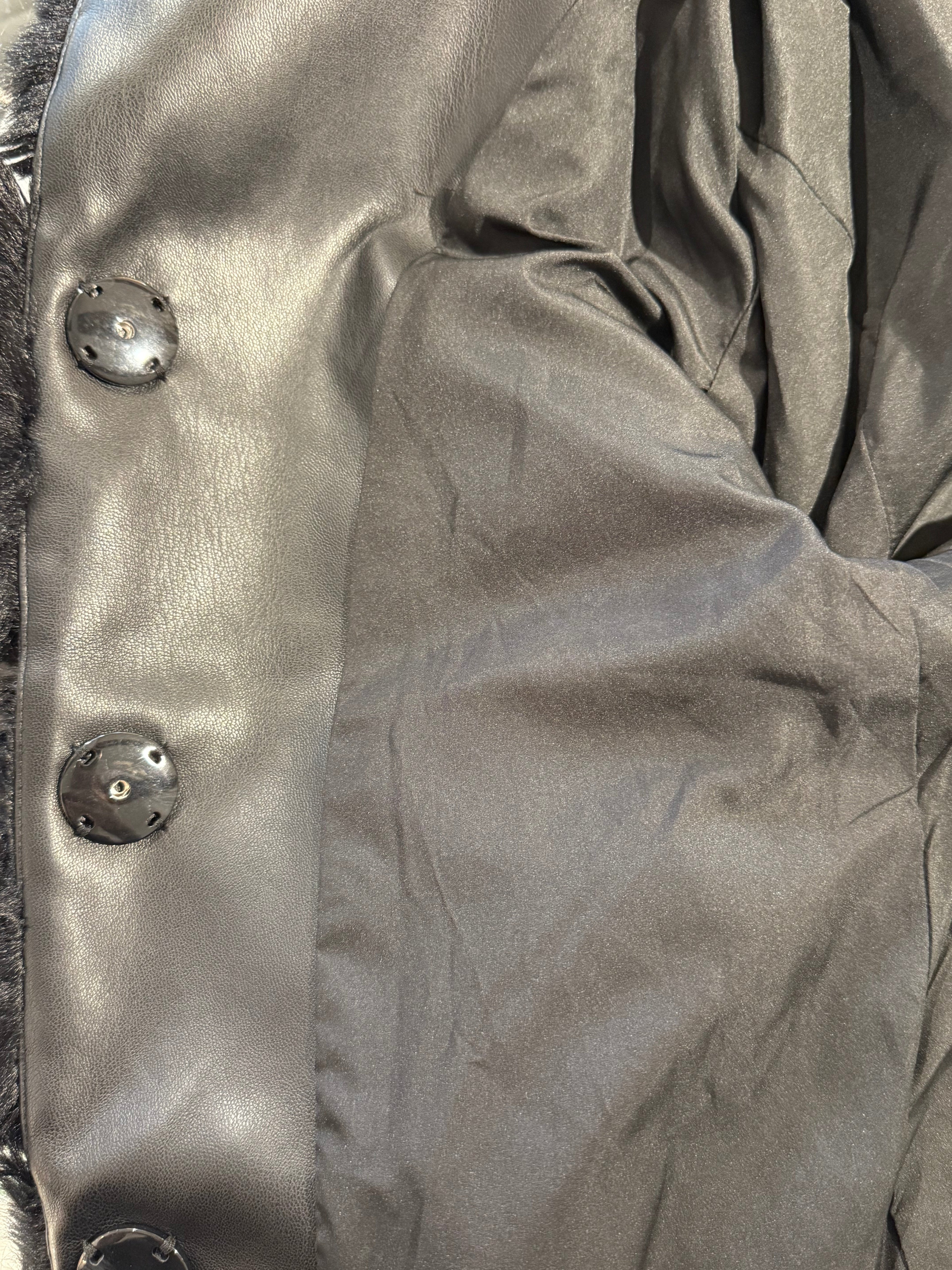 Faux fur jacket with knitted sleeves